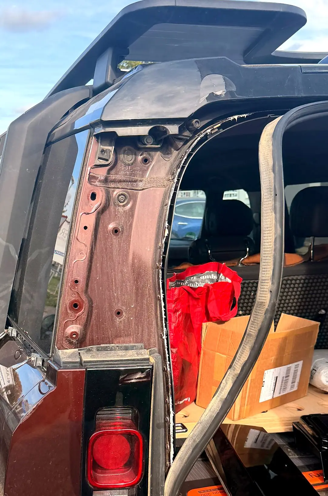 D-pillar with the original trim removed and the rear seal pulled back