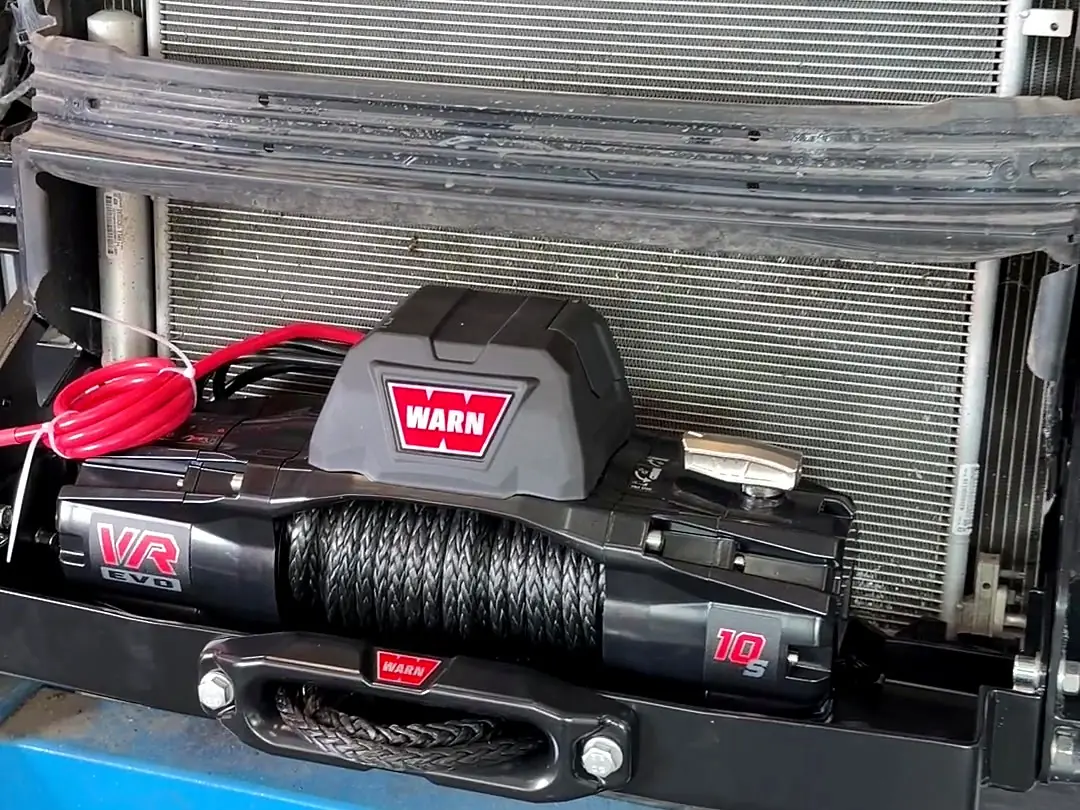 WARN VR EVO 10S winch sitting on the MP winch plate in front of the radiator, bumper removed
